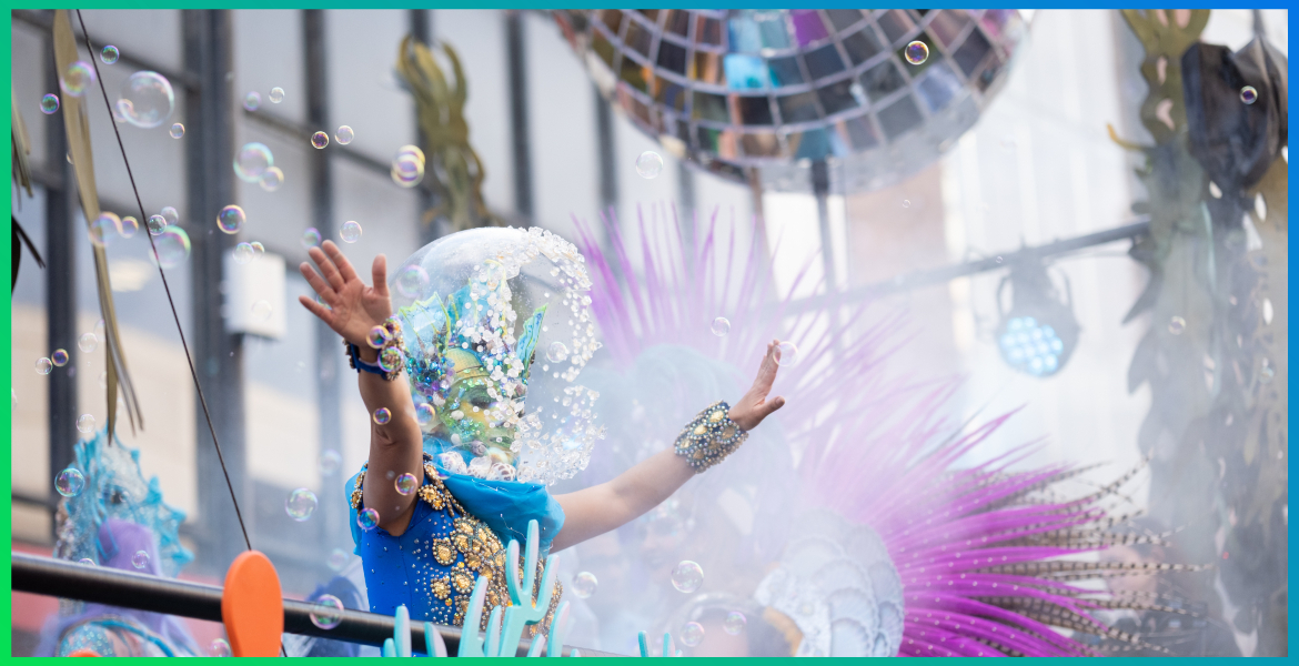 picture of a person dressed in a sea themed costume, a disco ball hanging above