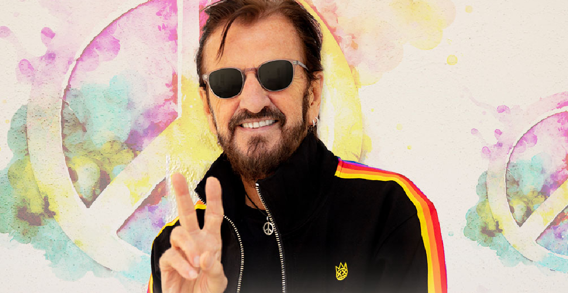 An image of Ringo Starr gesturing a peace sign with his hand in front of a graphic artwork background of bright vibrant colours and a peace sign.