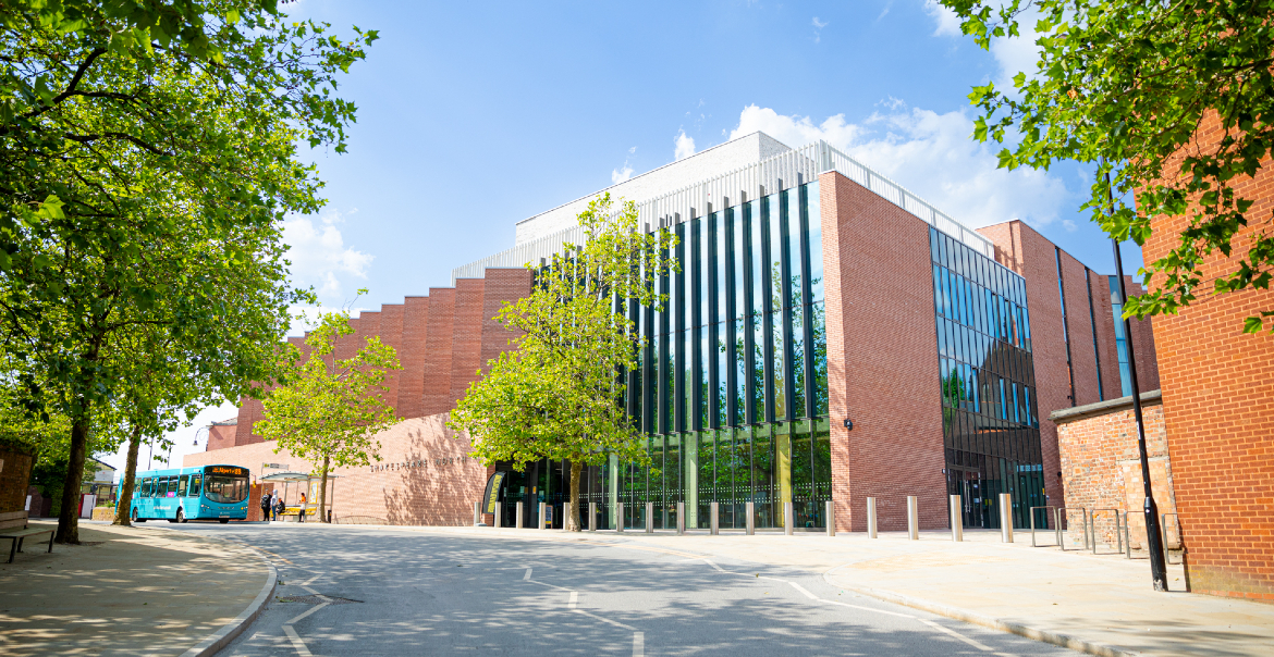 The exterior of Shakespeare North Playhouse theatre on a sunny day.