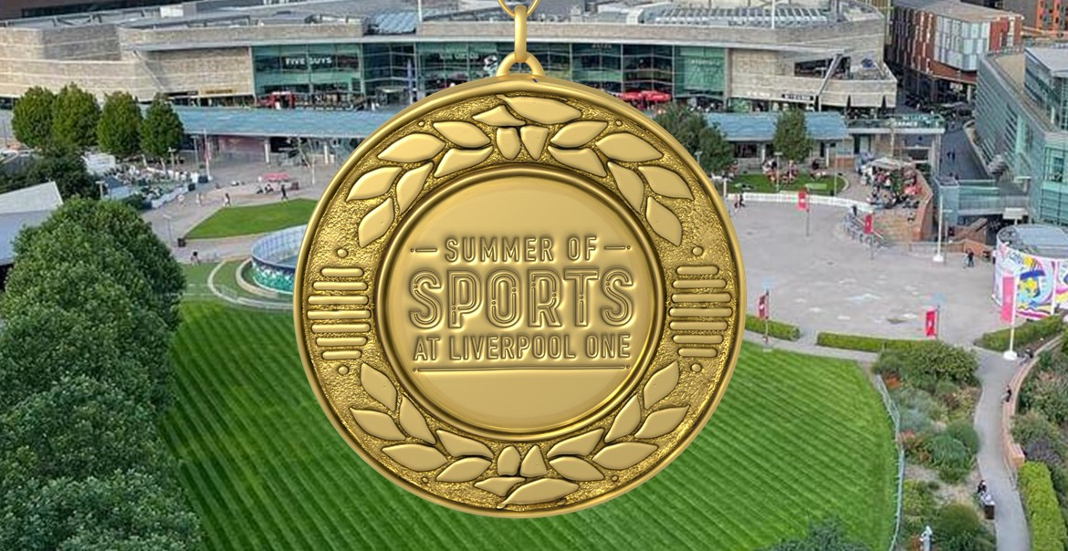 A gold medal reading "Summer of Sport" with Liverpool One's Chavasse Park in the background.