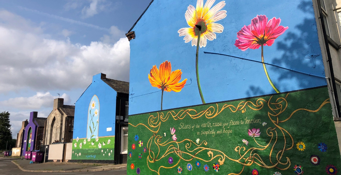 Stunning murals featuring a variety of flowers brightens up building's exterior