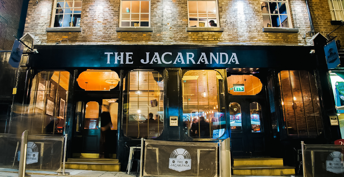 Jacranda exterior at night.