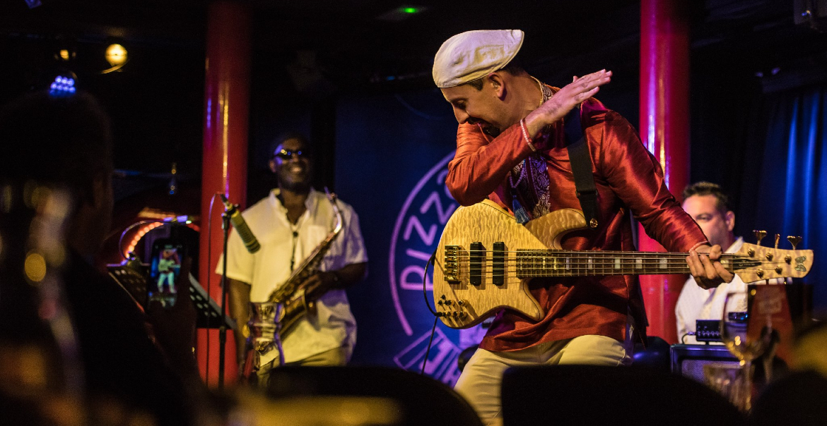 A musical band performing on stage.