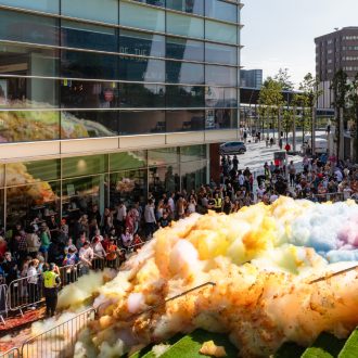 An explosion of colourful foam on Sugar House Steps, Liverpool ONE on a sunny day.